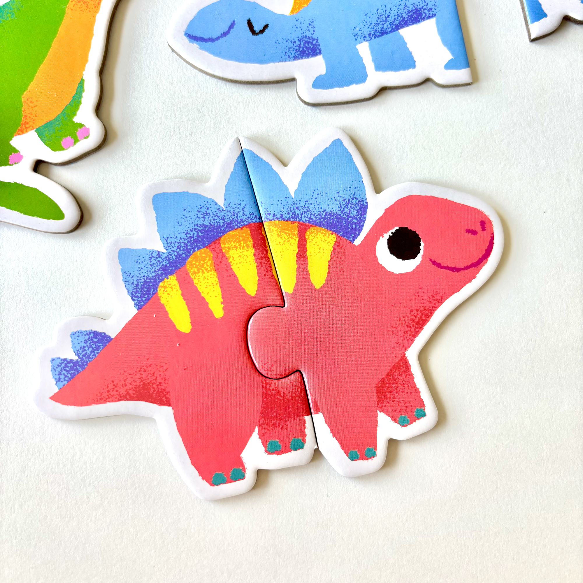 Dino Duo puzzle game, illustrated by Anna Hurley