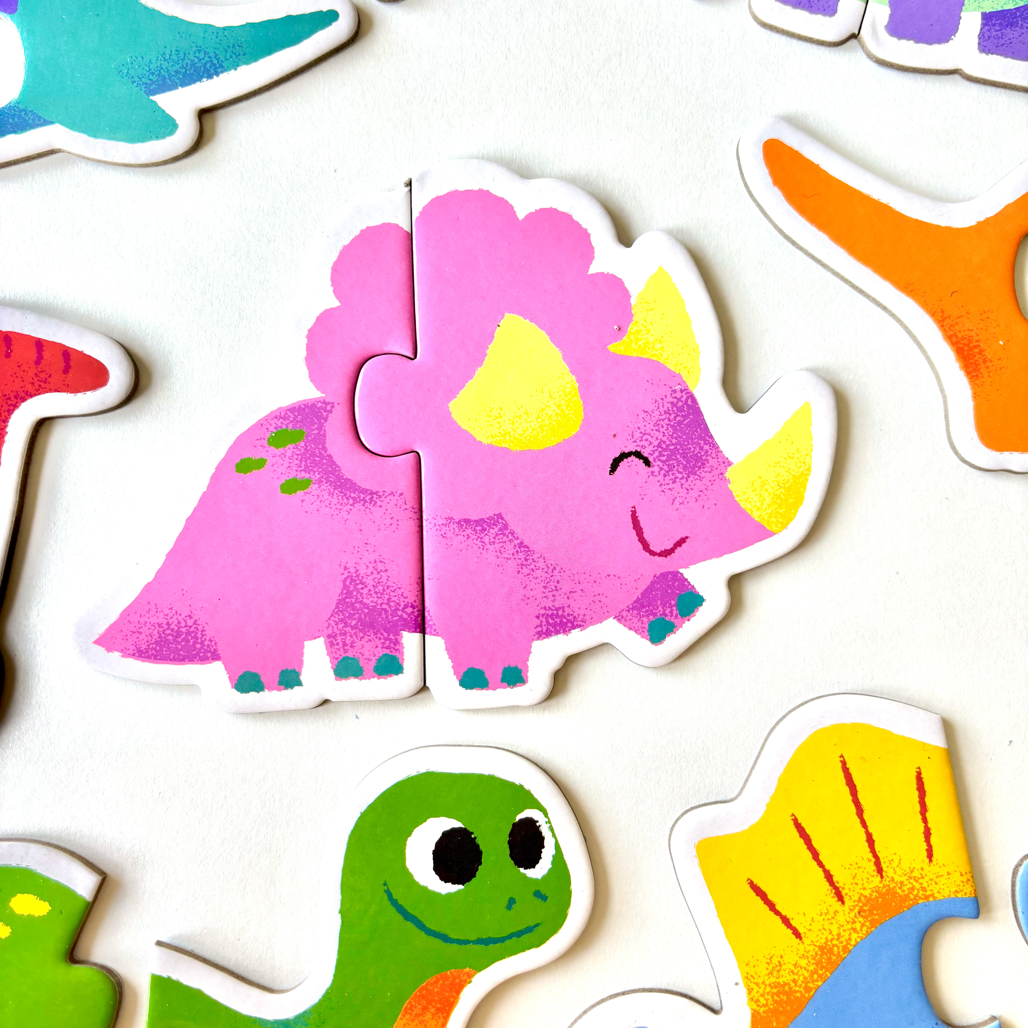 Dino Duo puzzle game, illustrated by Anna Hurley